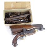 Gun parts box full of locks barrels some early parts with the stock of a Martini Henry rifle and