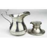 Two silver items comprising cream jug hallmarked Birm. 1931 and a small Capstan inkwell (with a