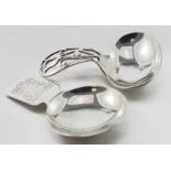 Two silver caddy spoons. hallmarked Birmingham, 1920 and Birmingham, 1968. The second one relates to