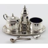 Three piece silver cruet set, comprising of salt, pepper and mustard, plus two silver spoons and a