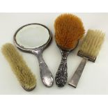 Silver-backed mirror with three silver- backed brushes - various hallmarks - WC, London, 1893 (1)