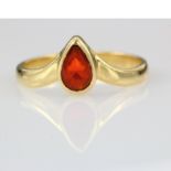 Yellow metal (tests as 18ct) ring set with a teardrop shaped fire opal. Size P 3.1g