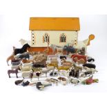 Wooden Noahs Ark model, with a collection of approximately forty carved & painted wooden animals &