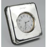Silver mounted travelling clock, has a nickel plated Goliath watch in the centre (missing the