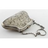 Attractive silver purse with leather interior (the catch does not snap together tightly). Hallmarked