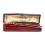 Yellow metal & blue enamel propelling pencil, ornately decorated, with stamp containing initials