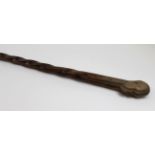 Tribal carved walking stick / cane, with a tribal head as the handle, circa early 20th Century,