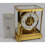 Jaeger LeCoultre brass Atmos mantel clock, front pane of glass missing, height 23.5cm, width 21cm,