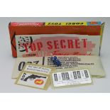 Corgi Toys. An original cardboard insert For James Bond no. 270 (1966), with unopened Secret