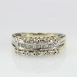 9ct white gold band ring set with a row of baguette cut diamonds with a further row either side of