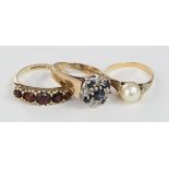 Three 9ct rings to include a garnet five stone graduated carved head ring, finger size P weight 2.