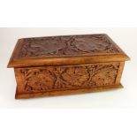 Carved wooden box with floral decoration, height 13.5cm, width 37cm, depth 21cm approx.