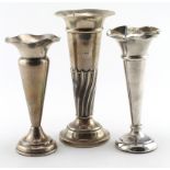 Three silver flower tubes, all have loaded bases. Hallmarked Birmingham 1906, 1915 and Sheffield