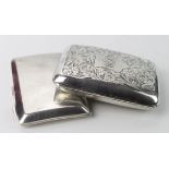 Two silver cigarette cases, hallmarked Birmingham 1918 and Birmingham 1929. Combined weight of