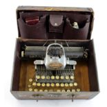 Blickensderfer Aluminium Featherweight typewriter, contained in a leather case