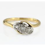 18ct diamond three stone crossover ring, finger size K weight 2.7g