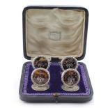 Set of four silver and tortoise shell circular menu holders inlaid with floral pattern, hallmarked