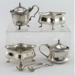 Two silver mustard pots (including one blue glass liner), two silver open salts and two silver