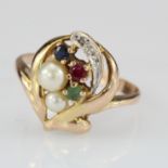 9ct dress ring set with two pearls, a ruby sapphire and emerald, finger size R, weight 2.9g