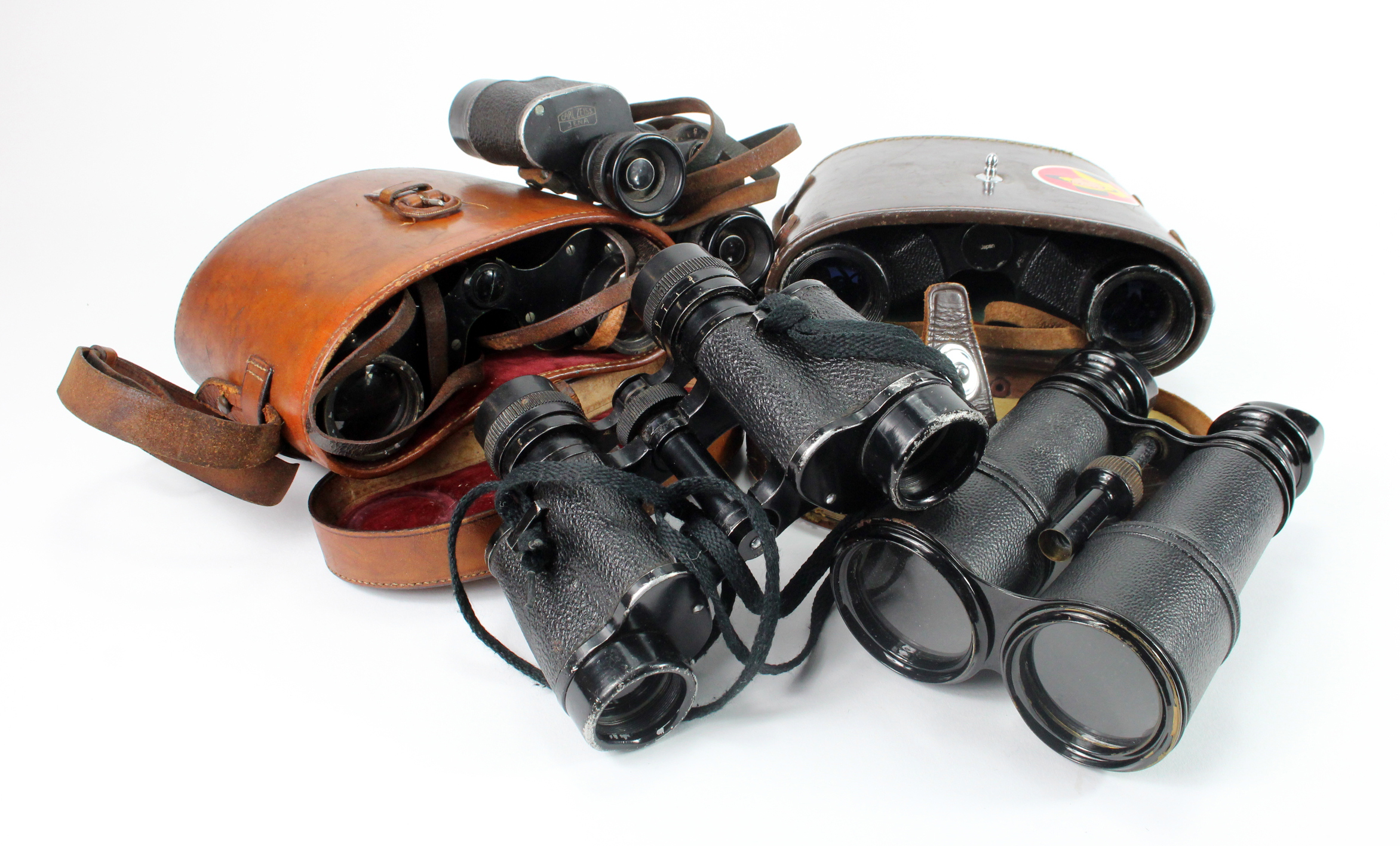 Binoculars. Five pairs of binoculars, including two in leather cases, makers include Carl Zeiss