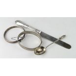 Silver lot comprising two silver bangles, silver spoon and a part silver knife. Weighs 1.5oz free
