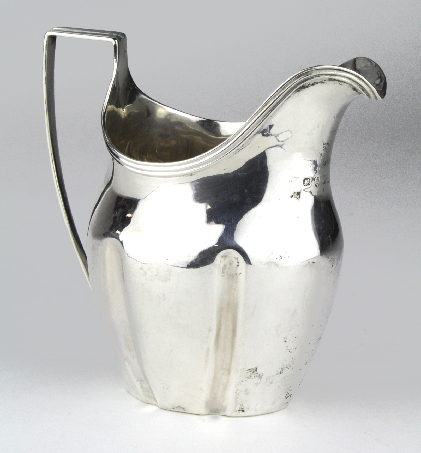 Georgian silver helmet shaped cream jug, hallmarked for London, 1799 (the marks are a bit worn).