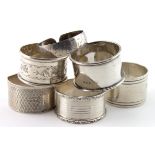 Six silver napkin rings, various hallmarks, one is marked "Sterling". Six items in total, weighs 4.