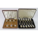 Two boxed sets of silver flatware, consisting of six silver bean-top spoons, hallmarked Sheffield,