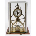 Brass skeleton mantel clock, white enamel dial with Roman numerals, pendulum & key present,