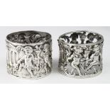 Two Cherub silver napkin rings, one, only marked with a maker's mark AF and the other has worn