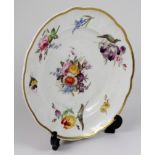 Nantgarw porcelain plate, decorated with hand painted flowers & a gilt rim, impressed Nantgarw