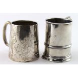 Two small silver mugs, both showing some damage, hallmarked Birmingham 1921 and 1926. Total weight