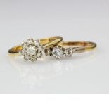 Two 18ct yellow gold diamond set rings, one cluster finger size M weight 3.8g. One three stone
