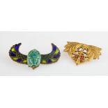 Two yellow metal brooches (one stamped 9ct), including an enamelled Egyptian Scarab brooch