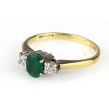 18ct gold ring set with a single emerald flanked by two diamonds, Size L. 2.4g