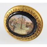 19th Century Italian Grand Tour souvenir micro mosaic brooch depicting St Peters Square. In a yellow