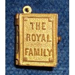 Royalty Collectables, a miniature souvenir charm in the form of a gold coloured metal hinged book of