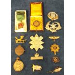 Militaria, military and other badges to include a Black Watch Kings Crown officer's cap badge,