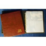Postcard accessories, two modern postcard albums, one maroon, the other brown, each with a good