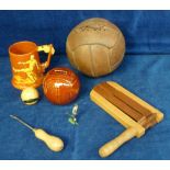 Football, a vintage, laced, leather football with lacing tool, a wooden football rattle, a metal