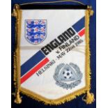 Football, Finland v England match pennant 1985, 16" x 12", fringed in gold with velvet covered brass