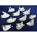 Collectables erotica, 11 glazed ceramic Japanese figures showing positions of the Kamasutra, each