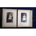 Photographs. Victorian leather small format Carte de Visite album with good clasp containing 39 cdvs