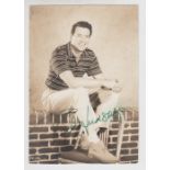 Autograph, Rock Hudson, a b/w photo 11cm x 16cm showing Hudson in casual clothes signed in green ink