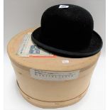 Vintage bowler hat by Woodrow, Piccadilly, London, width front to back 8in, within hat box.