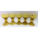 Set of five olive green German glass roemers, the stems with applied prunts, height 11cm.