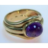 Contemporary 18ct gold amethyst cabochon set ring, stamped 750, weight 11.2g approx.