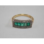 Art Deco 18ct platinum set diamond & emerald cluster ring, the five square cut emeralds surrounded