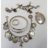 Miscellaneous silver jewellery including two charm bracelets, two silver Christening bangles, locket