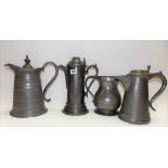 Three 19th Century pewter hinge lidded jugs; together with a quart measure (4).